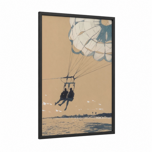 Coastal Parasailing framed art print — black wood frame — cream and blue palette