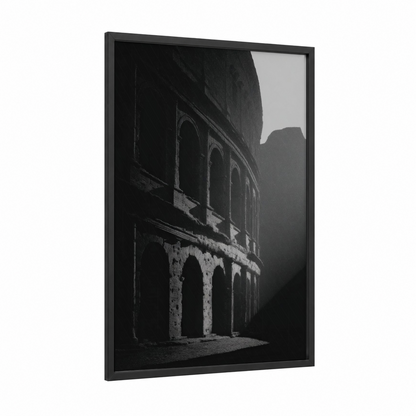 Shadowed Colosseum framed art print — black wood frame — black and white palette