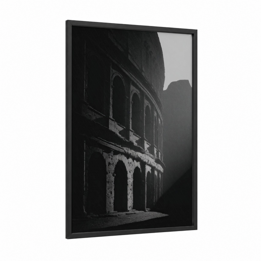Shadowed Colosseum framed art print — black wood frame — black and white palette