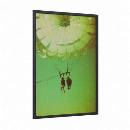 Aerial Parasailing Adventure framed art print — black wood frame — light green and gold palette