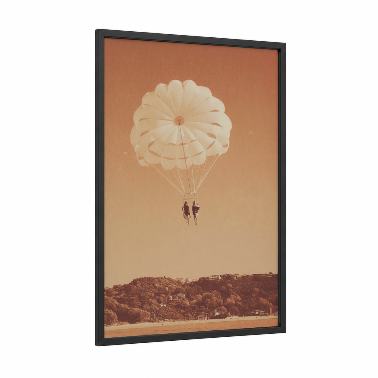 Golden Parasail Pair framed parasailing print — black wood frame — peach and russet palette