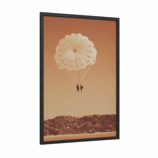 Golden Parasail Pair framed parasailing print — black wood frame — peach and russet palette