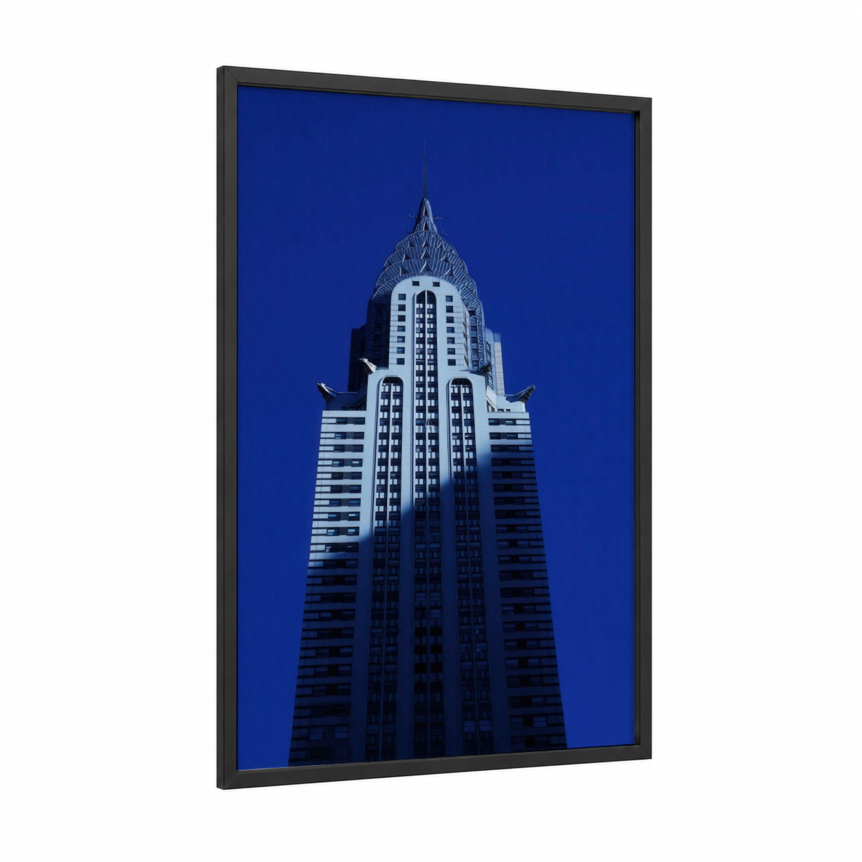 Chrysler Building Ascent framed monuments print — black wood frame — royal blue and blue and white palette