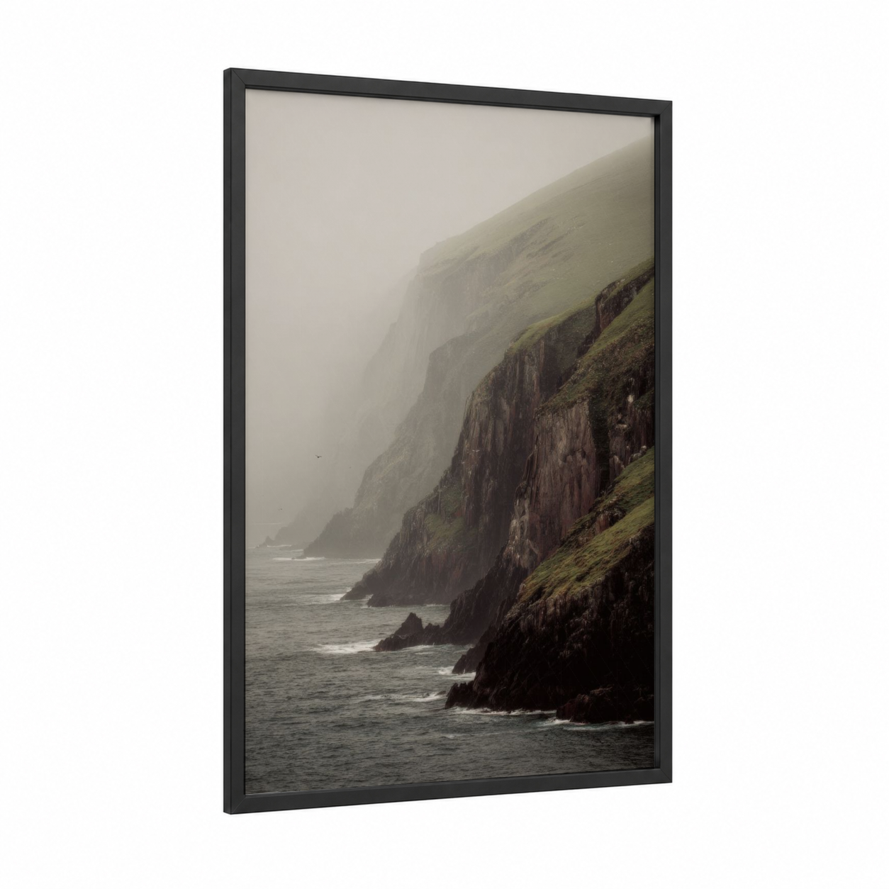 Misty Sea Cliff framed art print — black wood frame — dove gray and dark green palette