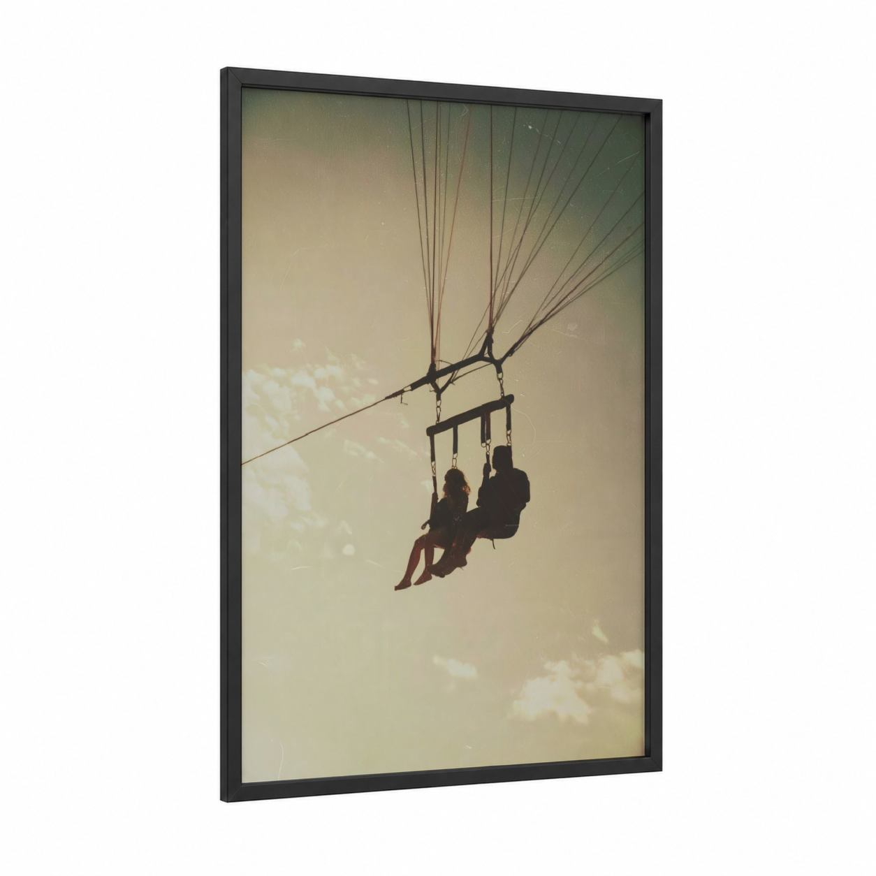 Aerial Freedom Duo framed parasailing print — black wood frame — gold and black and white palette