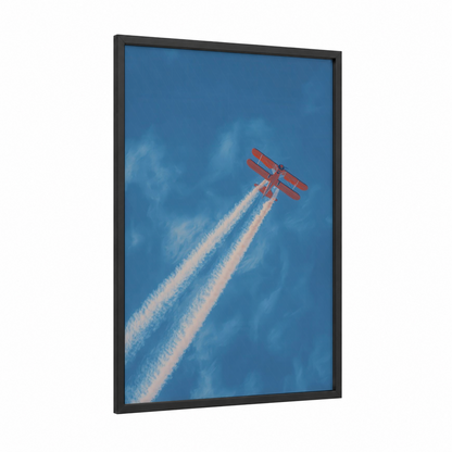 Crimson Sky Acrobat framed propeller plane print — black wood frame — blue and red palette