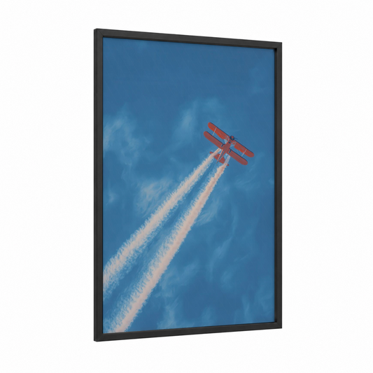 Crimson Sky Acrobat framed propeller plane print — black wood frame — blue and red palette
