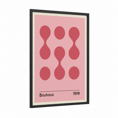 Bauhaus Circles framed abstract geometric print — black wood frame — pink and rose gold palette