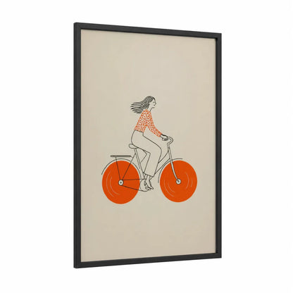 Woman Cycling Orange Bicycle Wall Art framed art print — black wood frame — orange and beige palette