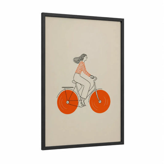 Woman Cycling Orange Bicycle Wall Art framed art print — black wood frame — orange and beige palette