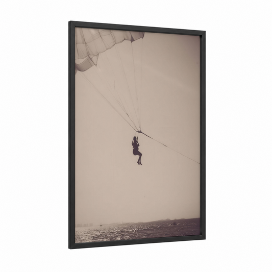 Coastal Parasailing framed art print — black wood frame — beige and gray palette
