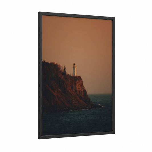 Coastal Lighthouse Sunset framed art print — black wood frame — orange and teal palette