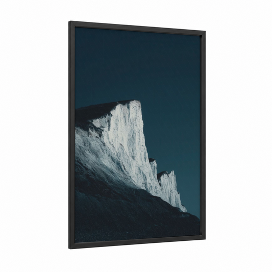 Chalky Coastline framed cliff print — black wood frame — white and dark blue palette