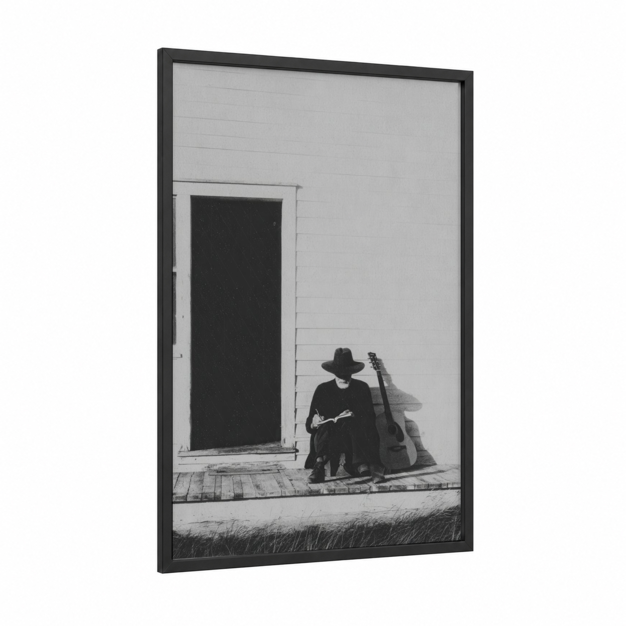 Solitary Musician framed country print — black wood frame — black and white palette