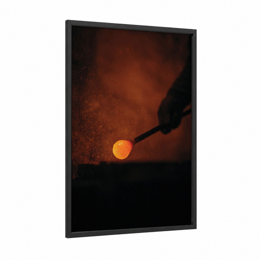 Molten Glow framed glassworking print — black wood frame — orange and black palette