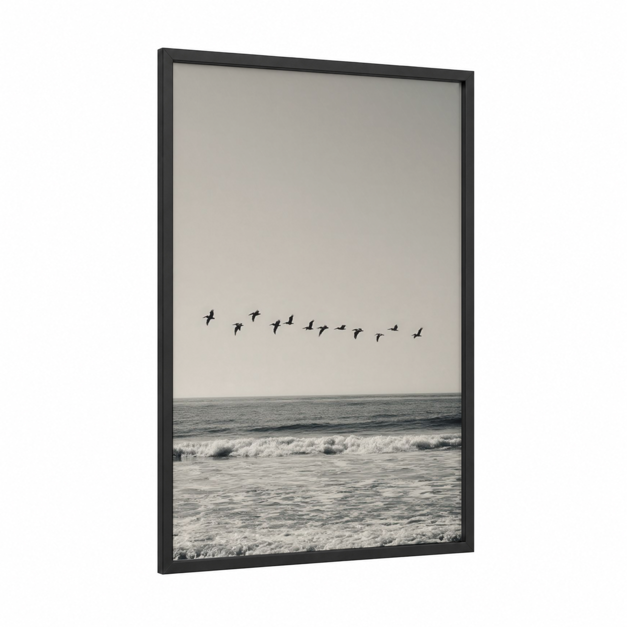 Coastal Pelican Flight framed art print — black wood frame — gray and black and white palette