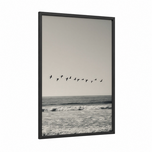 Coastal Pelican Flight framed art print — black wood frame — gray and black and white palette
