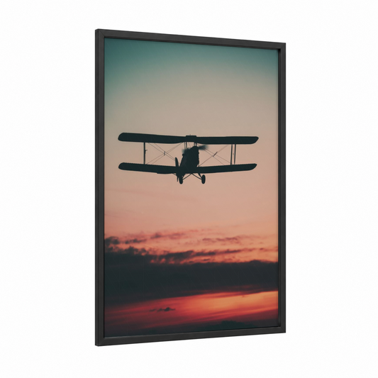 Sunset Biplane framed vintage airplane print — black wood frame — orange and gold palette